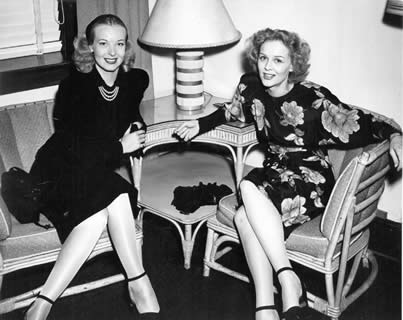 Gloria Stuart and Hillary Brooke relax in a lounge probably at the Enlisted
