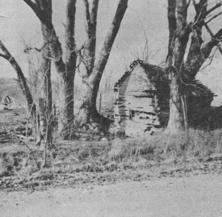 The old log springhouse at Dug Spring where on Friday, August 2, 1861, General Lyon's Regulars</br>fought General Rains' Missourians. The Wire Road is in the foreground.