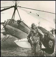  Amelia Earhart poses with an auto-giro.