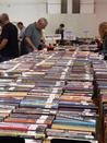 People browsing the mystery collection at the Friends of the Library Fall Book Sale. 