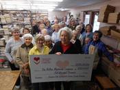 Friends of the Library members pose with large check for Renew Brentwood campaign.