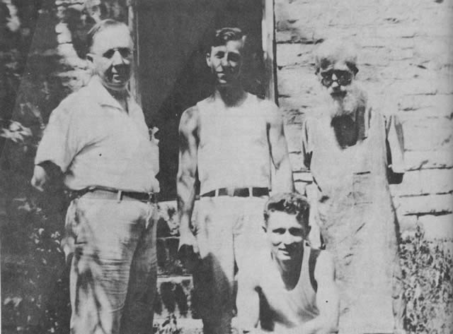 Newspaper staff in old Forsyth, Missouri, Summer 1935.  Left to right: (standing) W. E. Freeland; John Siv, now a printer with the St. Louis Post-Dispatch; printer (not identified); bottom row: Russ Howe, of St. Louis, Missouri.