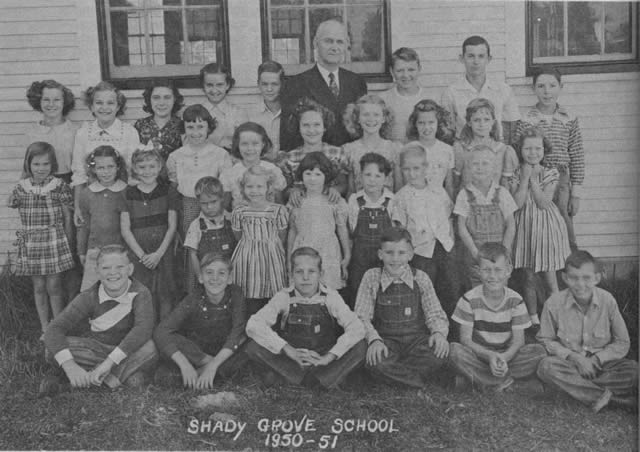 Mr. Bridges stands here in the back row of his pupils at Shady Grove School, three miles southwest of Sparta, Mo. After the year 1950-51, the school was closed and the pupils transported to the consolidated school in Sparta. Percy Bridges taught at this school seven terms.